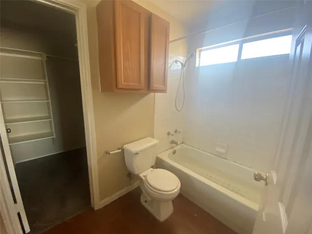 a bathroom with a toilet a sink and a bathtub