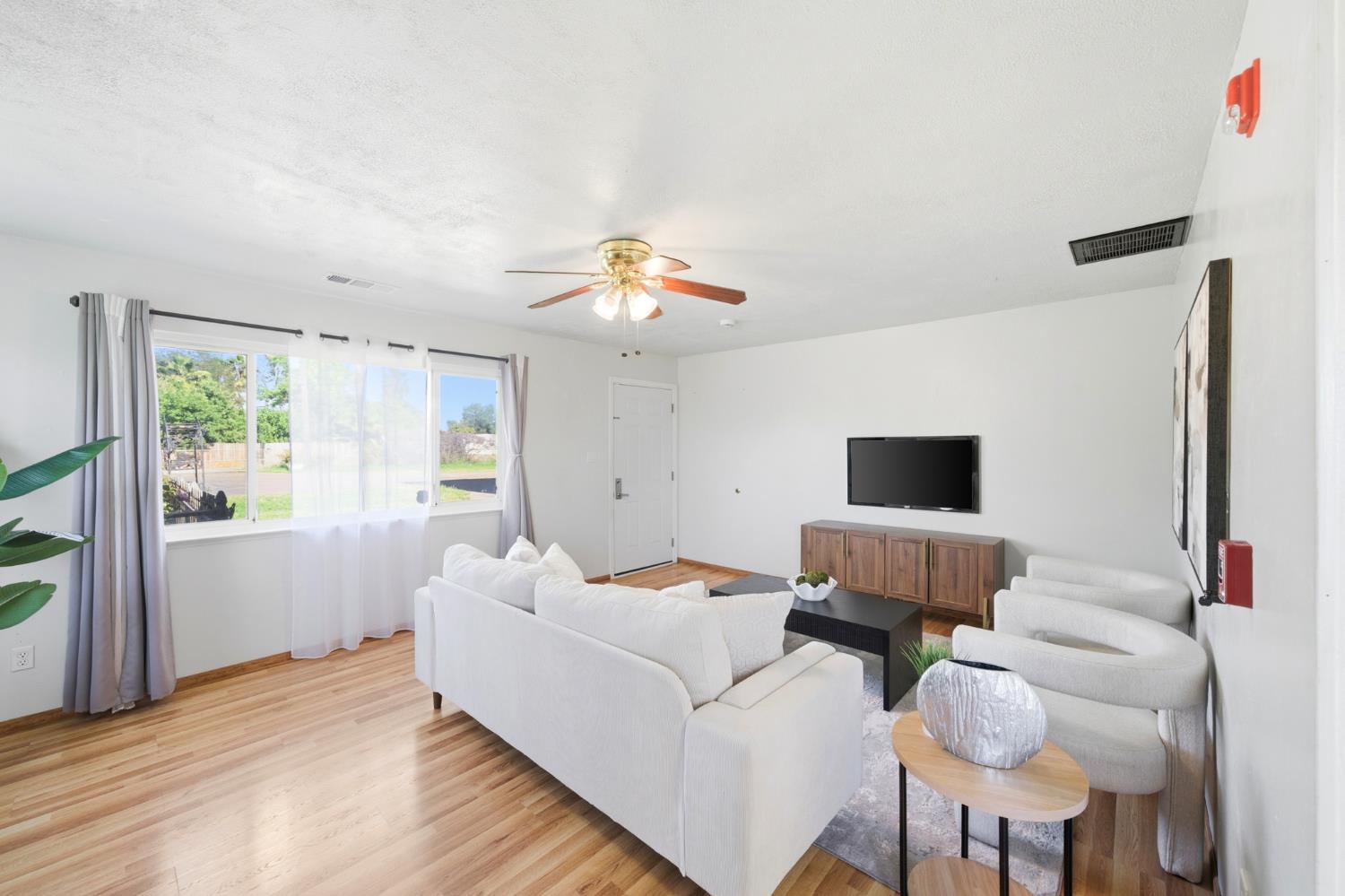 6515 West 4th Street Rio Linda, CA 95673 - Photo 19 of 97 a living room with furniture and a window