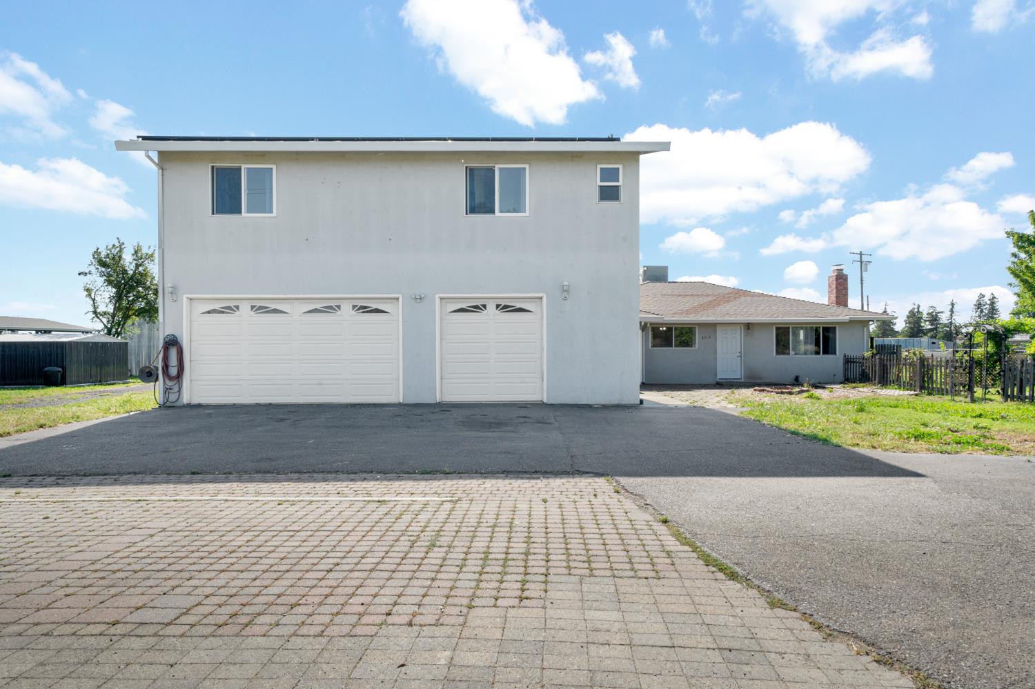 6515 West 4th Street Rio Linda, CA 95673 - Photo 3 of 97 a front view of a house with a yard and garage