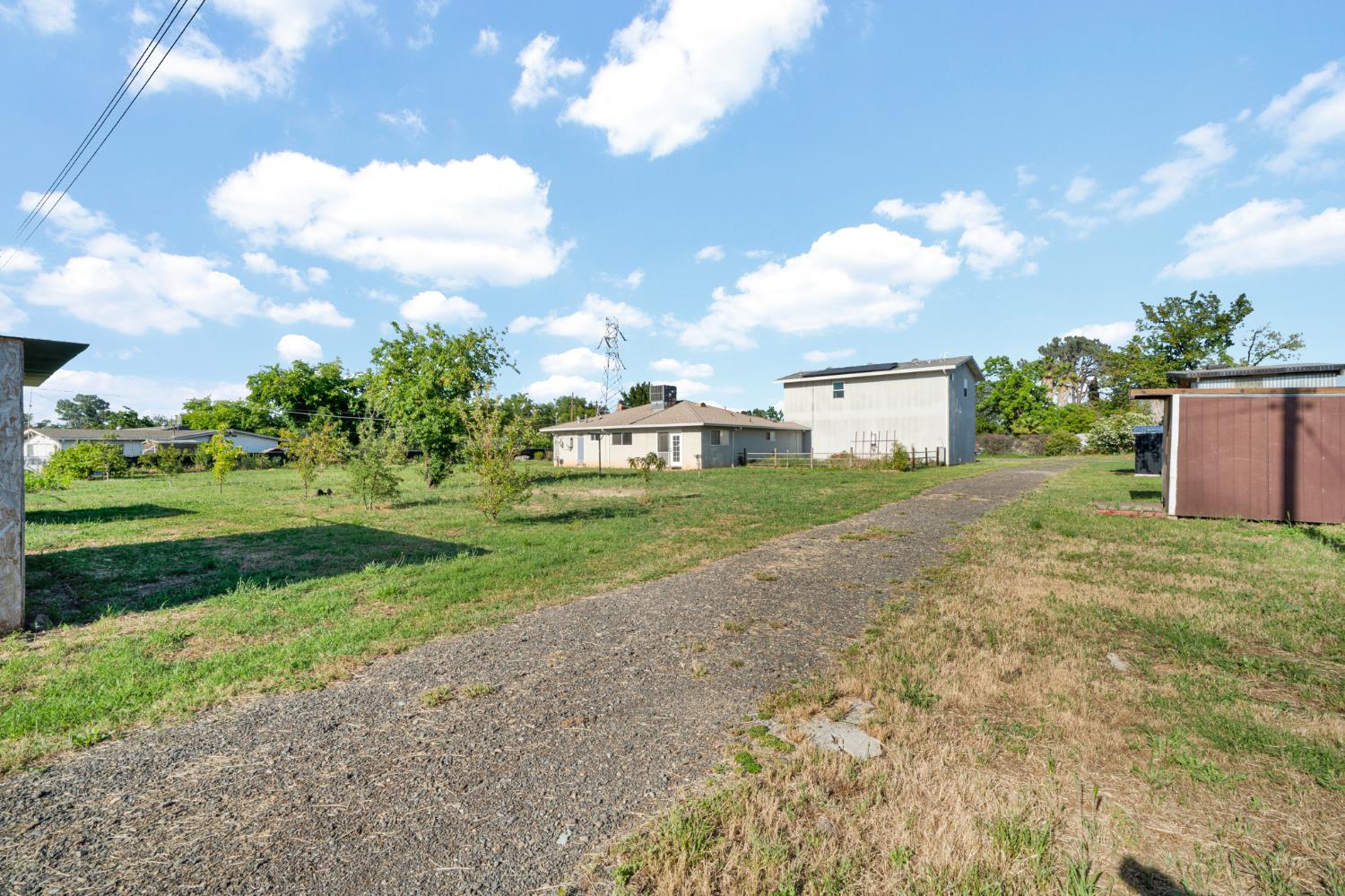 6515 West 4th Street Rio Linda, CA 95673 - Photo 53 of 97 a view of a house with a big yard and a large tree