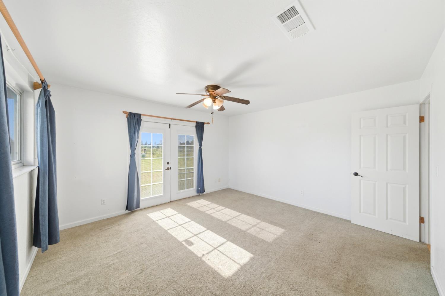 6515 West 4th Street Rio Linda, CA 95673 - Photo 62 of 97 a view of a chandelier fan and refrigerator in a room