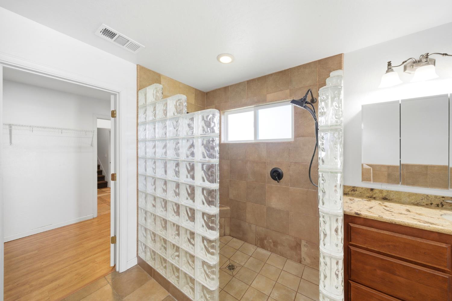 6515 West 4th Street Rio Linda, CA 95673 - Photo 66 of 97 a bathroom with a granite countertop shower and a sink