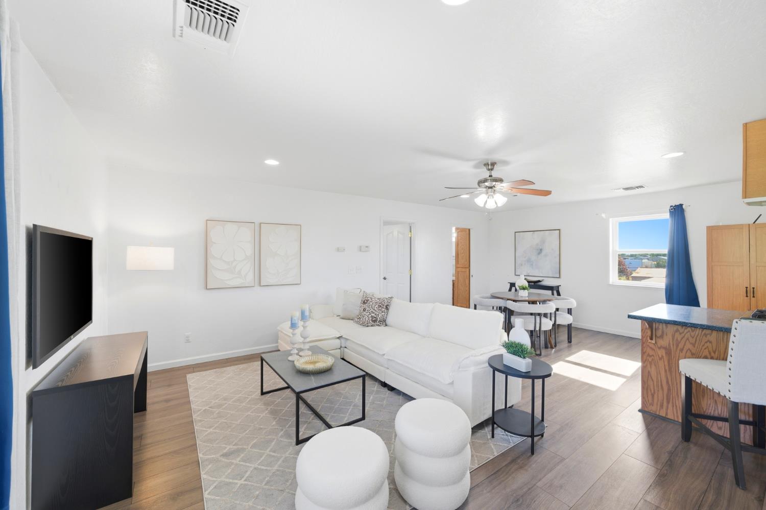 6515 West 4th Street Rio Linda, CA 95673 - Photo 73 of 97 a living room with furniture a flat screen tv and kitchen view