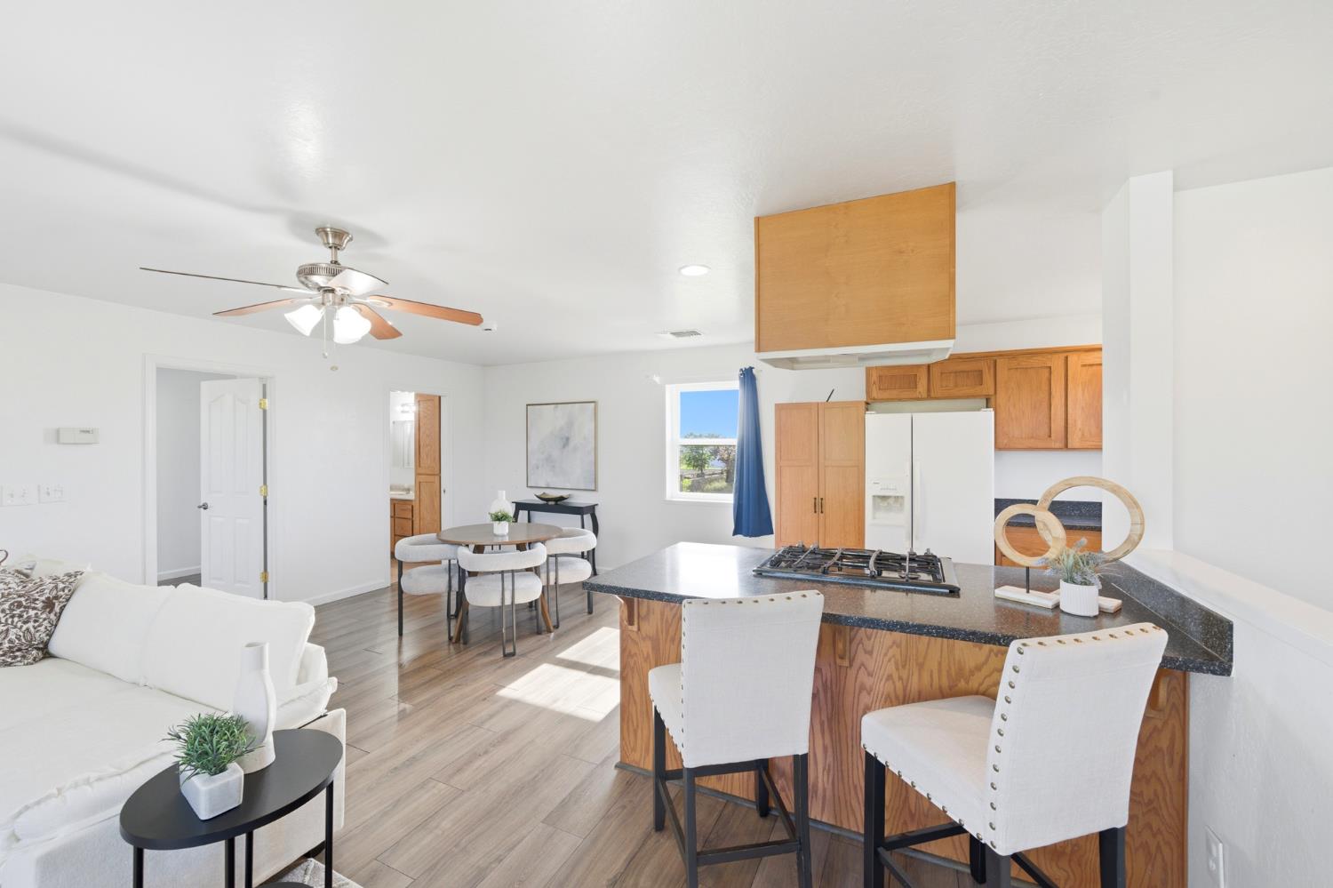 6515 West 4th Street Rio Linda, CA 95673 - Photo 74 of 97 a view of a dining room with furniture and wooden floor