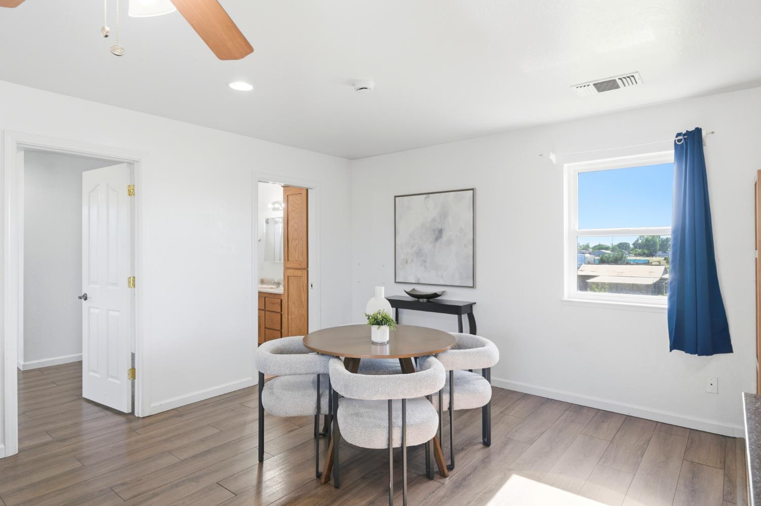 6515 West 4th Street Rio Linda, CA 95673 - Photo 75 of 97 a view of a dining room with furniture window and wooden floor