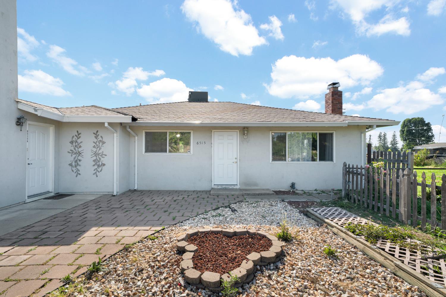 6515 West 4th Street Rio Linda, CA 95673 - Photo 9 of 97 a front view of a house with a yard