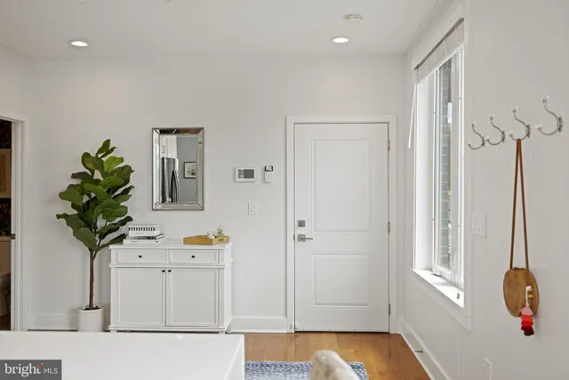 a living room with furniture and flowers