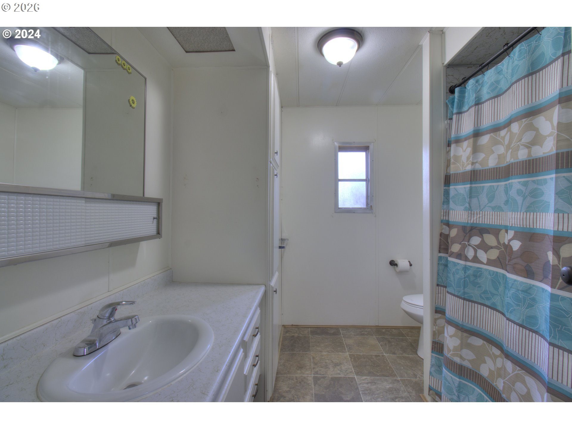 95171 Vista Loop Gold Beach, OR 97444 - Photo 12 of 35 a bathroom with a sink and a mirror