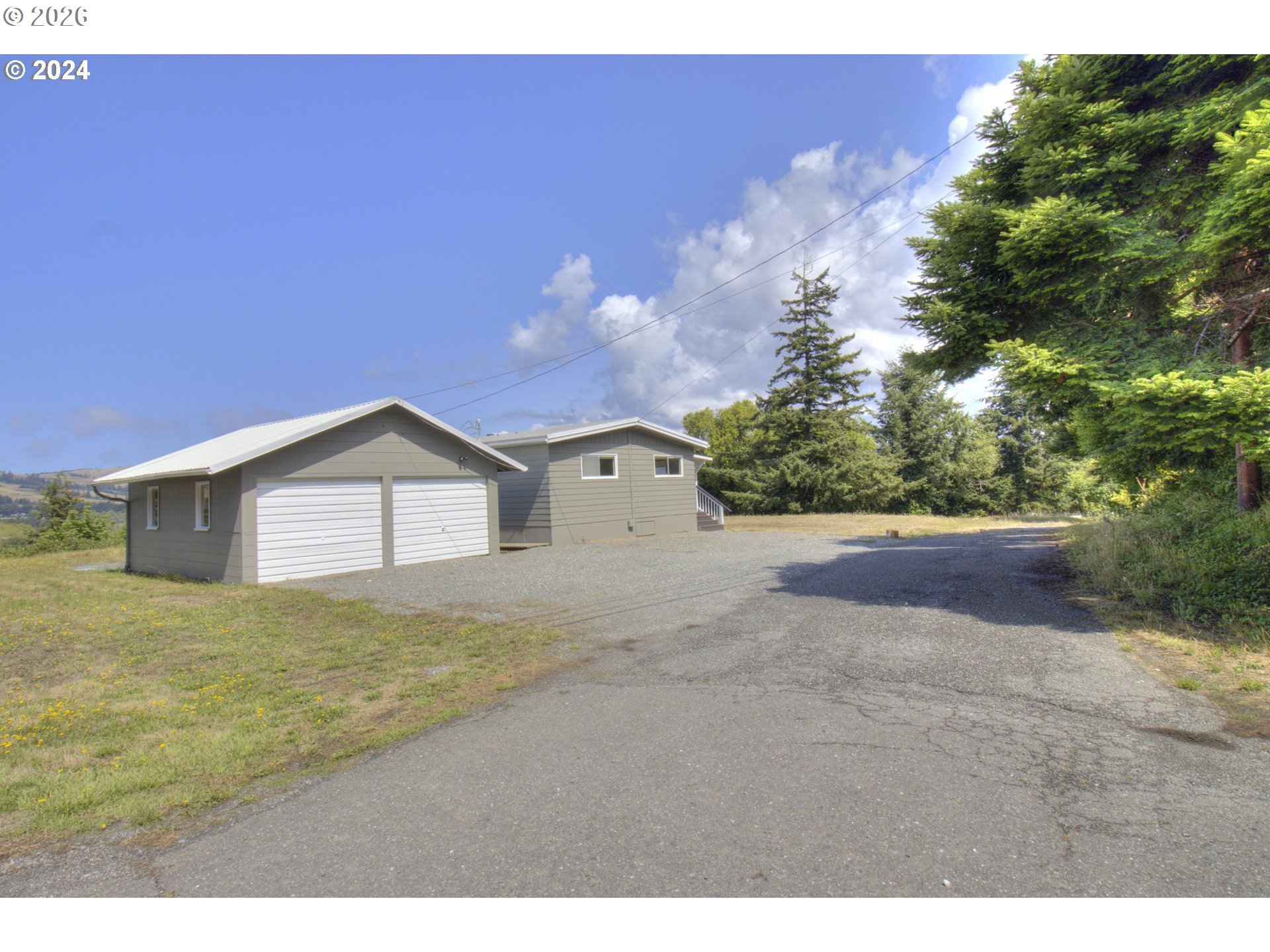 95171 Vista Loop Gold Beach, OR 97444 - Photo 27 of 35 a view of an house with backyard and garden