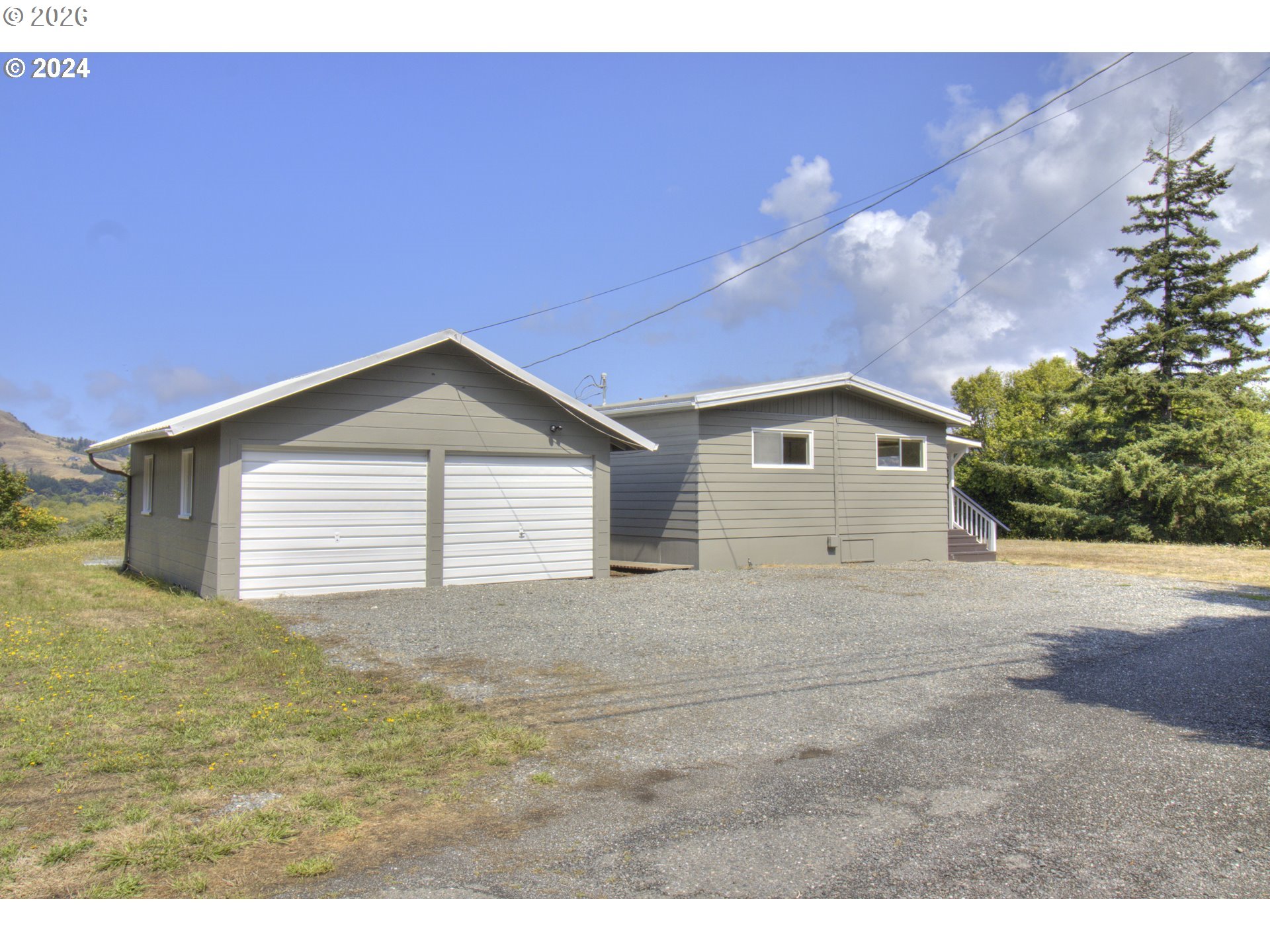 95171 Vista Loop Gold Beach, OR 97444 - Photo 28 of 35 a view of a house with a outdoor space