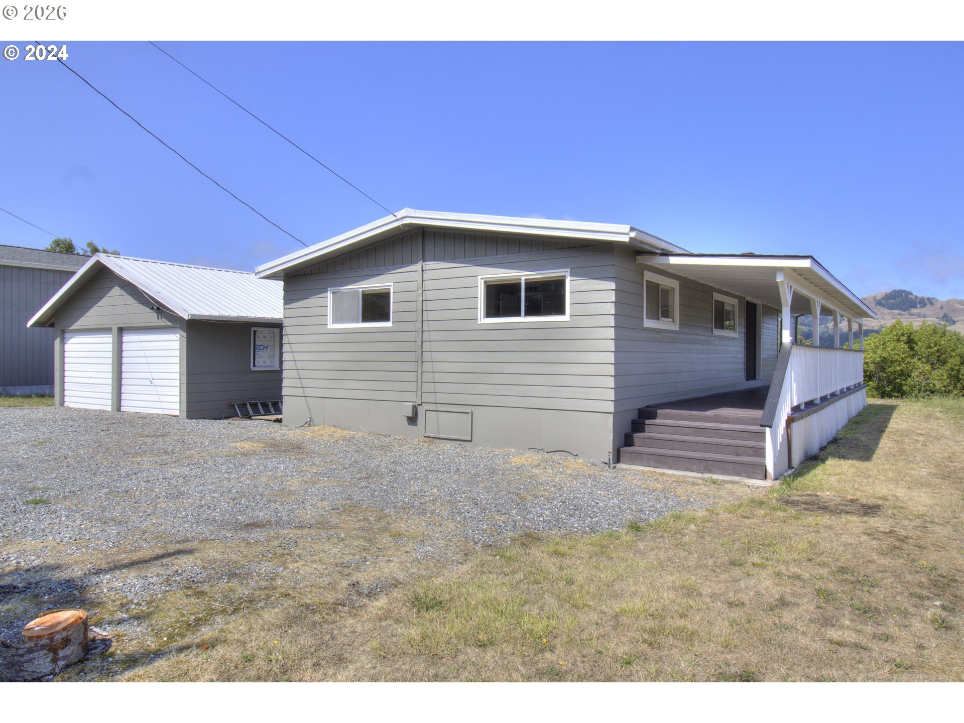 95171 Vista Loop Gold Beach, OR 97444 - Photo 30 of 35 a house view with a backyard space