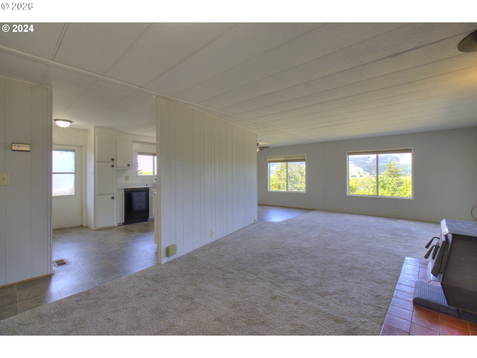 95171 Vista Loop Gold Beach, OR 97444 - Photo 3 of 35 a view of empty room with window and fireplace