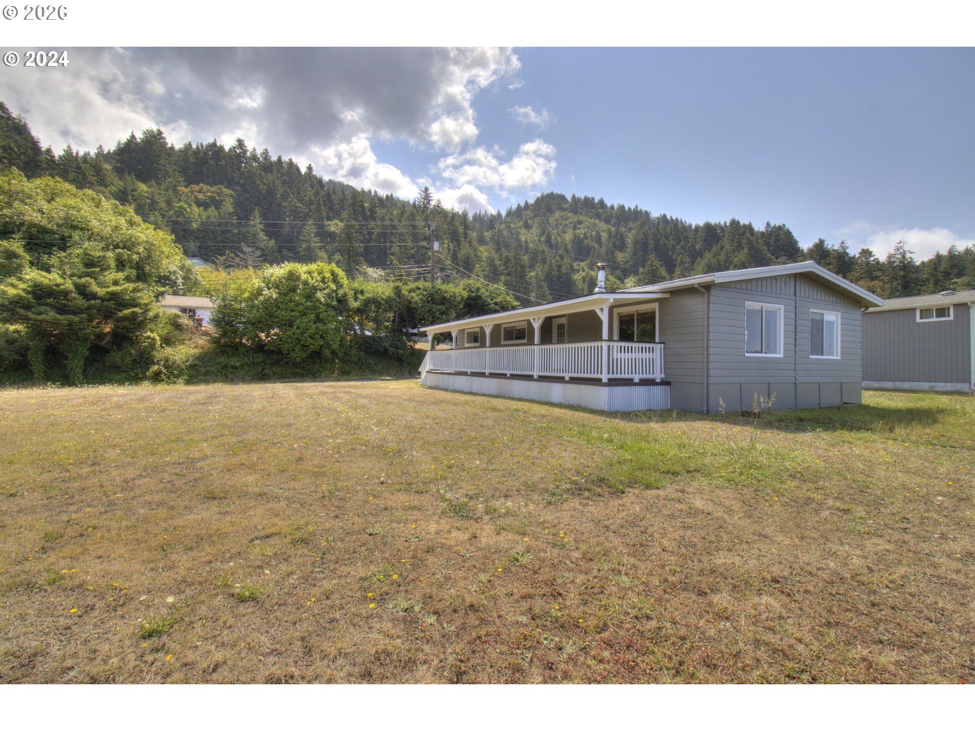 95171 Vista Loop Gold Beach, OR 97444 - Photo 32 of 35 a view of a house with a yard