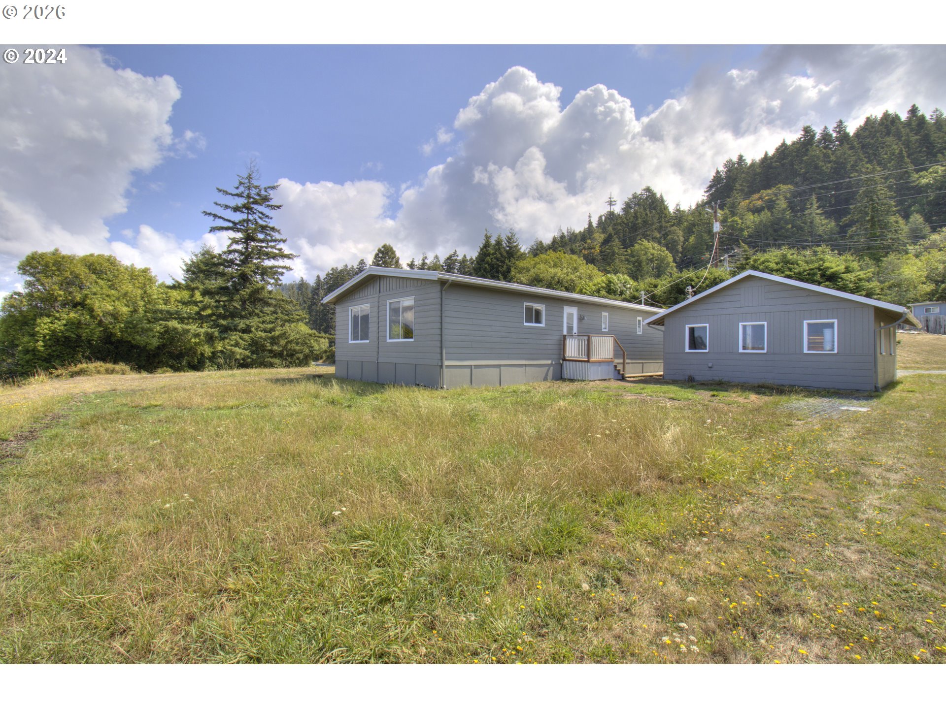 95171 Vista Loop Gold Beach, OR 97444 - Photo 33 of 35 a view of a house with a yard
