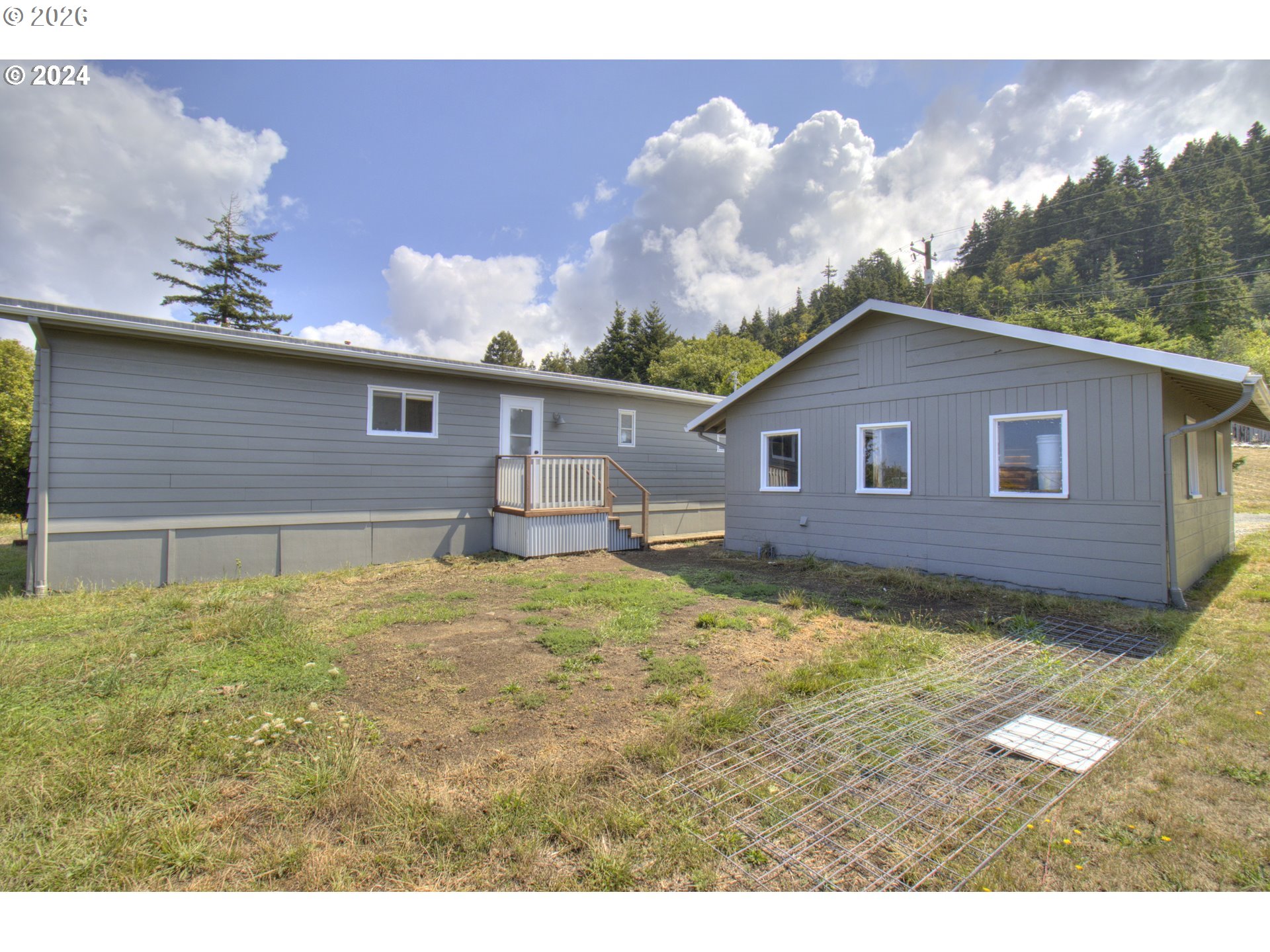 95171 Vista Loop Gold Beach, OR 97444 - Photo 34 of 35 a view of a house with a backyard