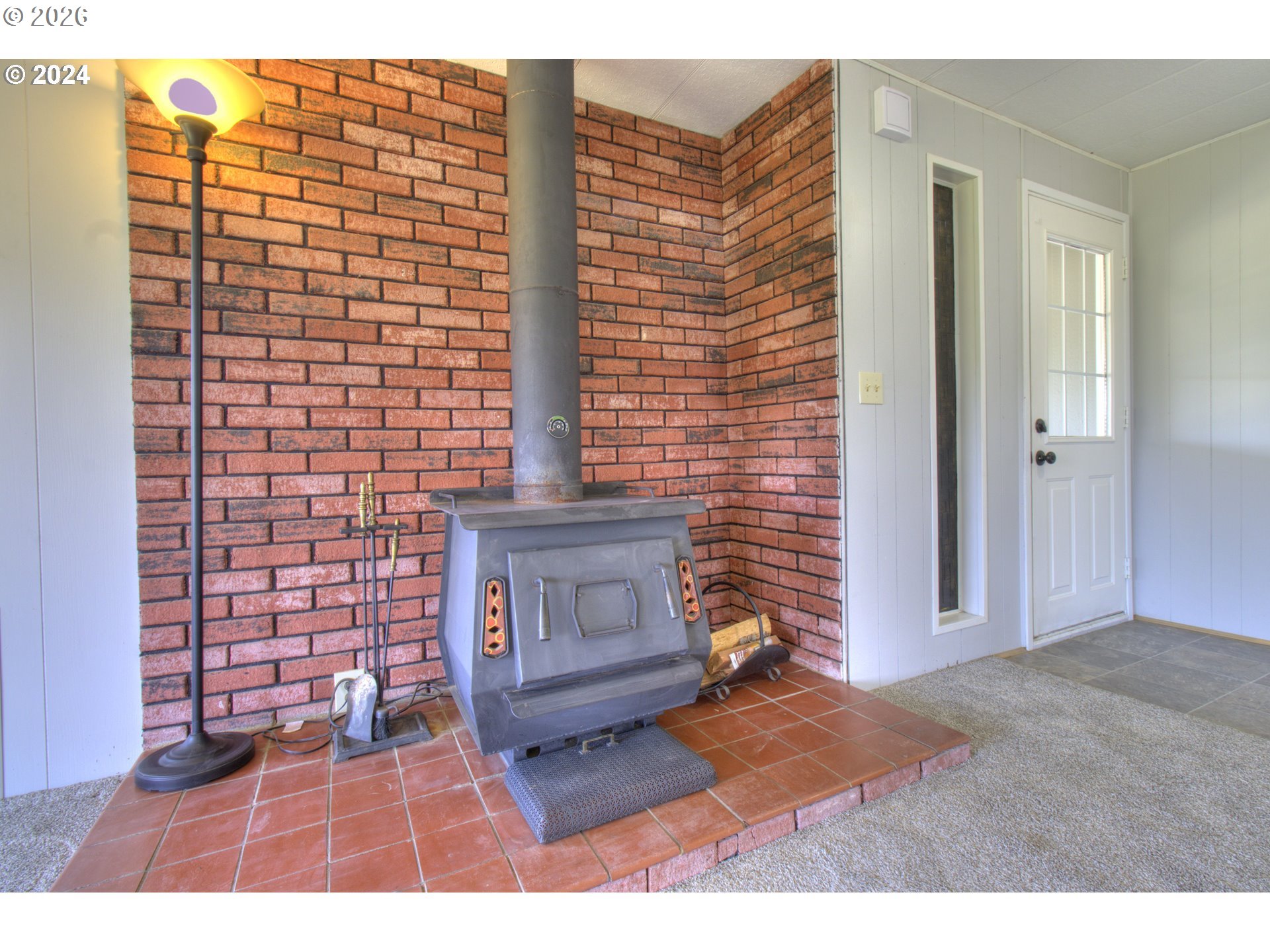95171 Vista Loop Gold Beach, OR 97444 - Photo 5 of 35 a view of an empty room and fire place