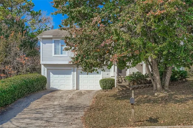 a view of a house with a backyard