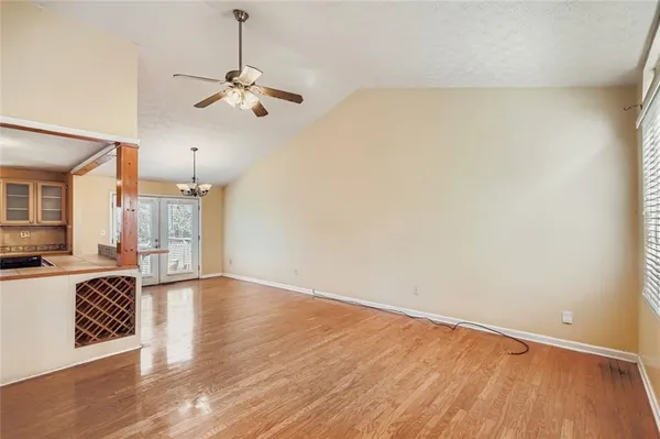 a view of a kitchen with a dishwasher cabinets and wooden floor