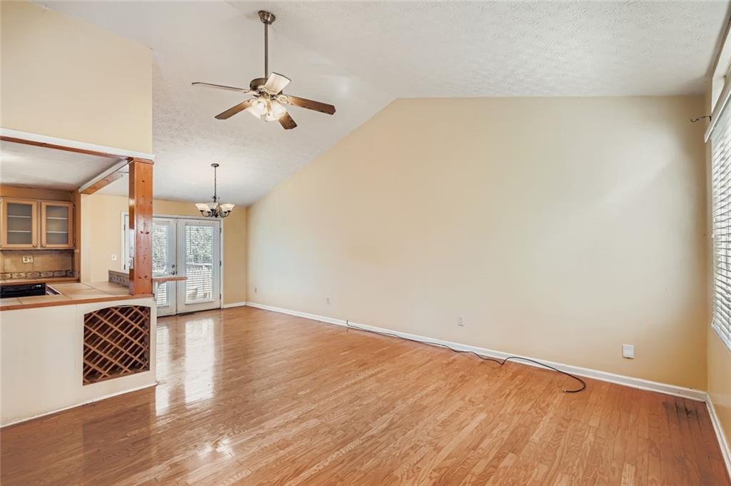 6134 Raintree Bend Lithonia, GA 30058 - Photo 5 of 17 a view of a kitchen with a dishwasher cabinets and wooden floor
