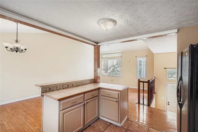 a view of entryway with furniture and wooden floor