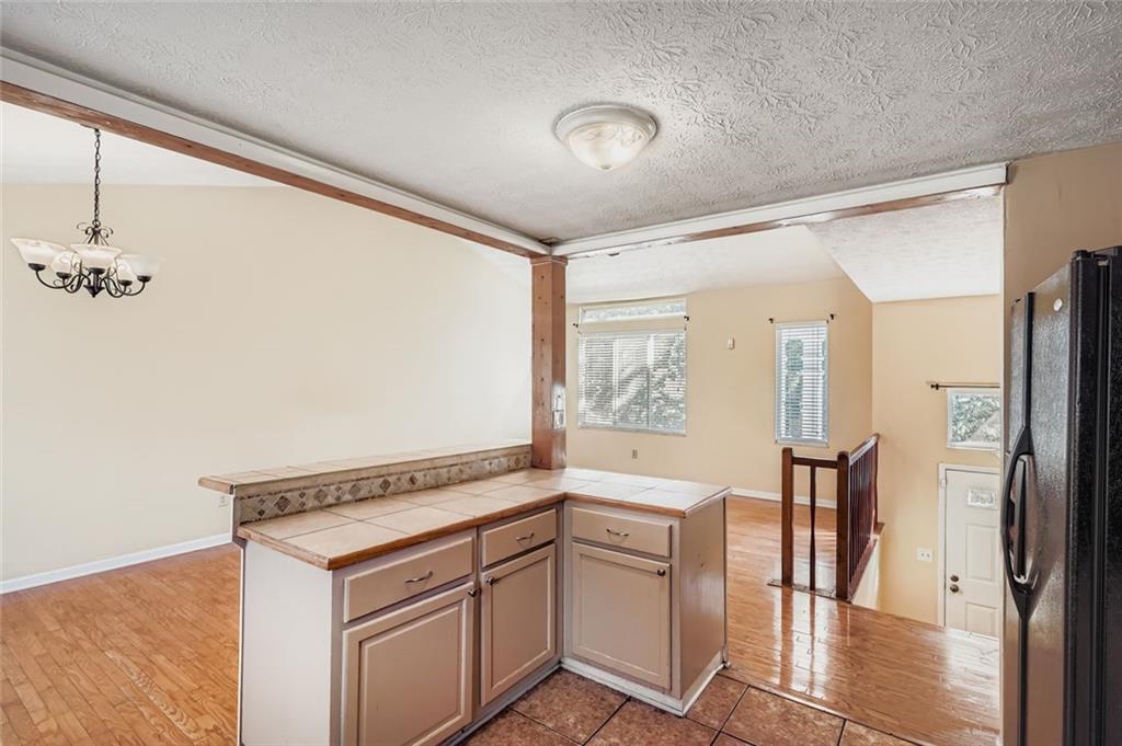 6134 Raintree Bend Lithonia, GA 30058 - Photo 9 of 17 a view of entryway with furniture and wooden floor
