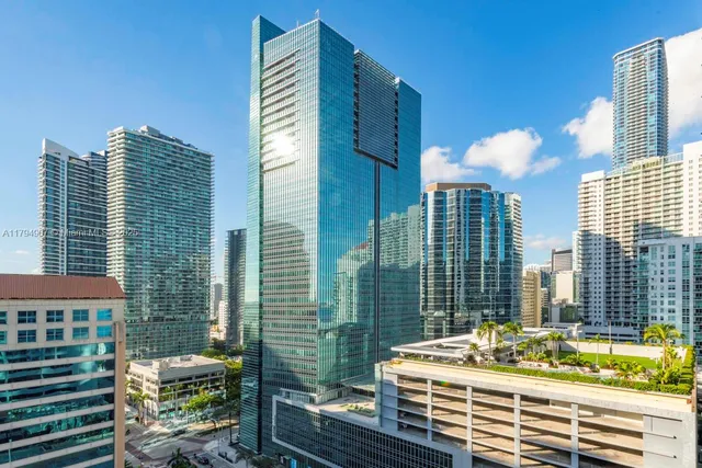 a table and chairs sitting in front of a house