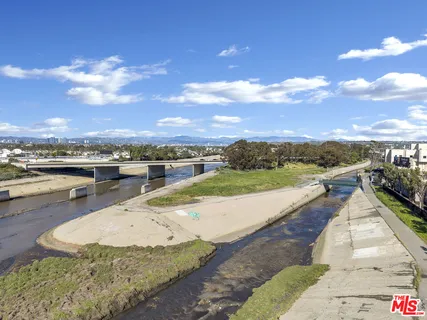 a view of a swimming pool with an outdoor seating