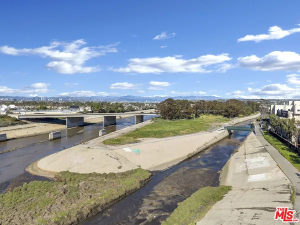a view of a swimming pool with an outdoor seating