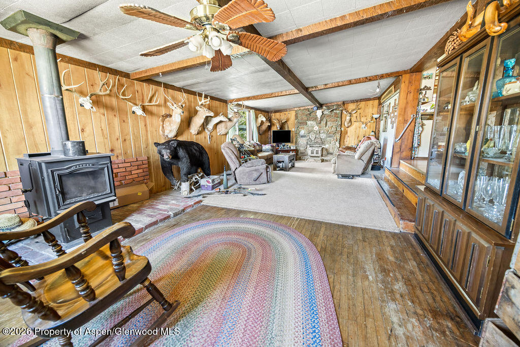 36 Collom Street Maybell, CO 81640 - Photo 27 of 43 a view of a patio with wooden floor and iron stairs