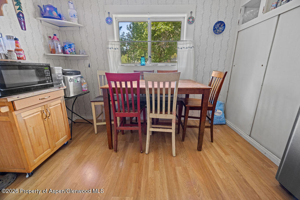 36 Collom Street Maybell, CO 81640 - Photo 43 of 43 a view of a dining room with furniture window and wooden floor