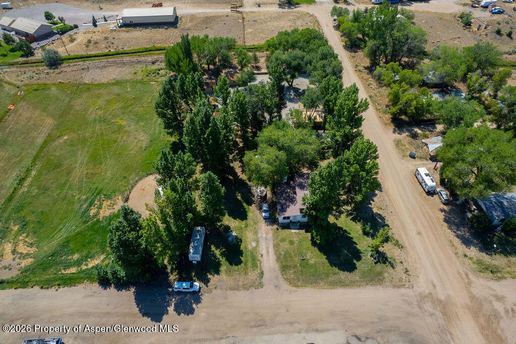36 Collom Street Maybell, CO 81640 - Photo 6 of 43 an aerial view of a house with a yard and lake view