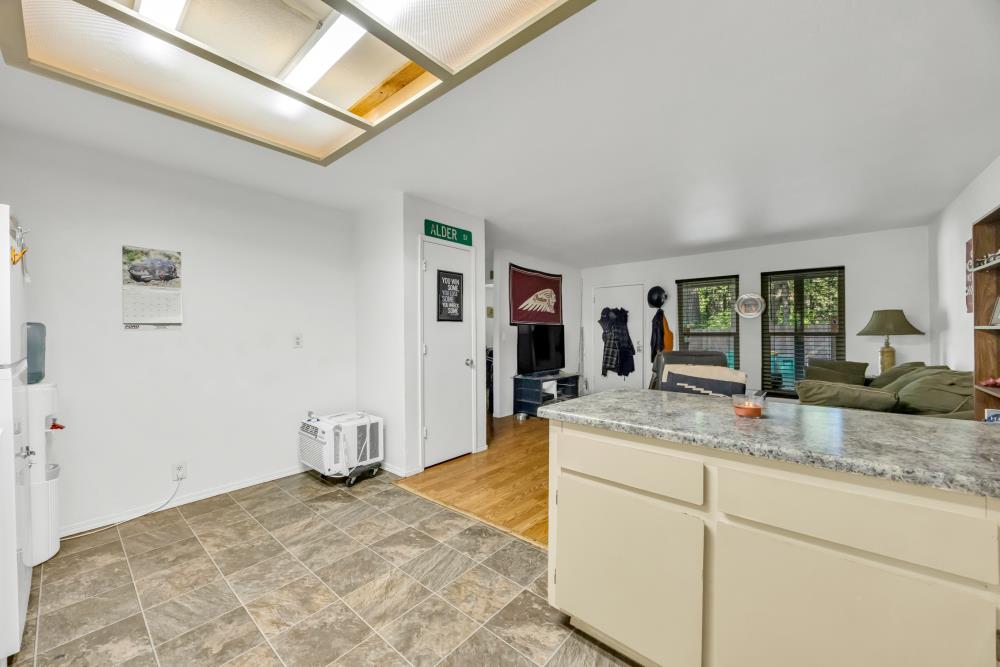 2960 Backpack Trail Pollock Pines, CA 95726 - Photo 11 of 49 a room with kitchen island a sink and natural light