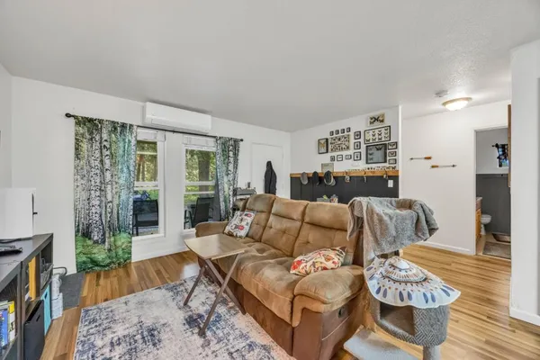 a living room with furniture and a table