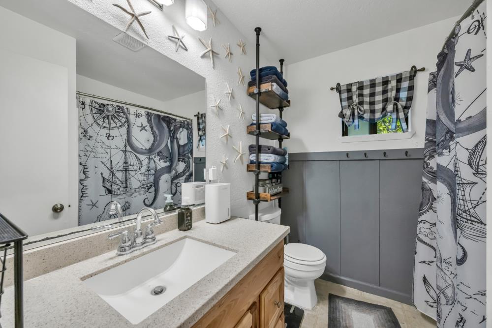 2960 Backpack Trail Pollock Pines, CA 95726 - Photo 30 of 49 a bathroom with a sink toilet and shower