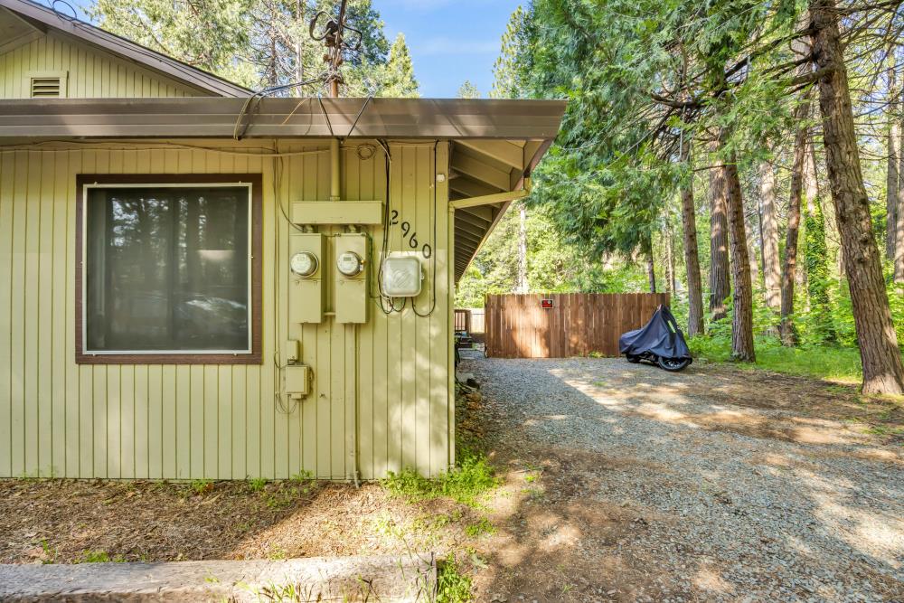 2960 Backpack Trail Pollock Pines, CA 95726 - Photo 40 of 49 a front view of a house with a yard