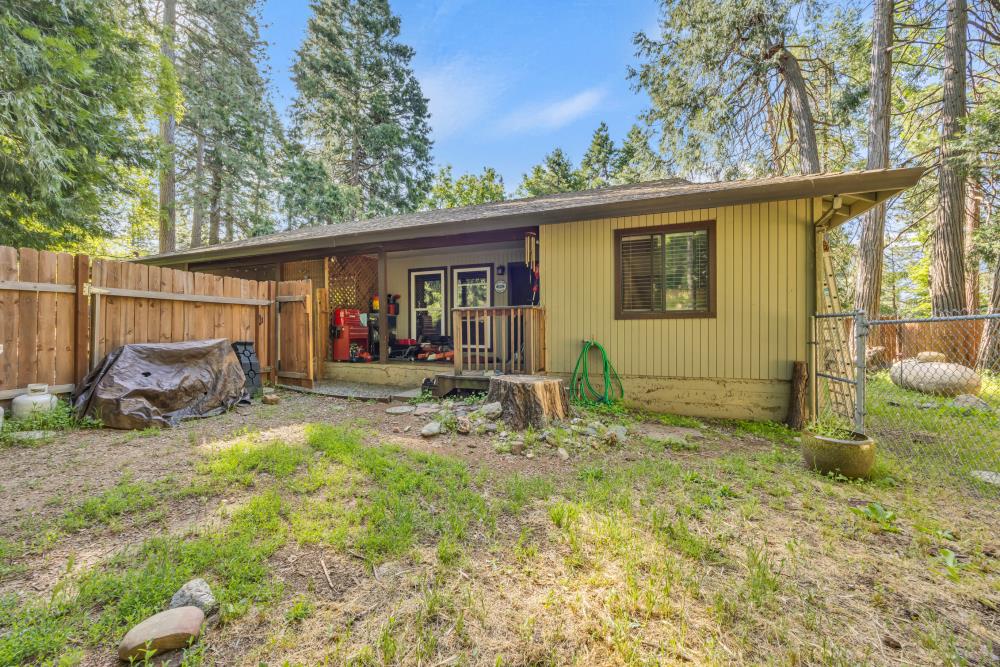 2960 Backpack Trail Pollock Pines, CA 95726 - Photo 5 of 49 a backyard of a house with yard and outdoor seating