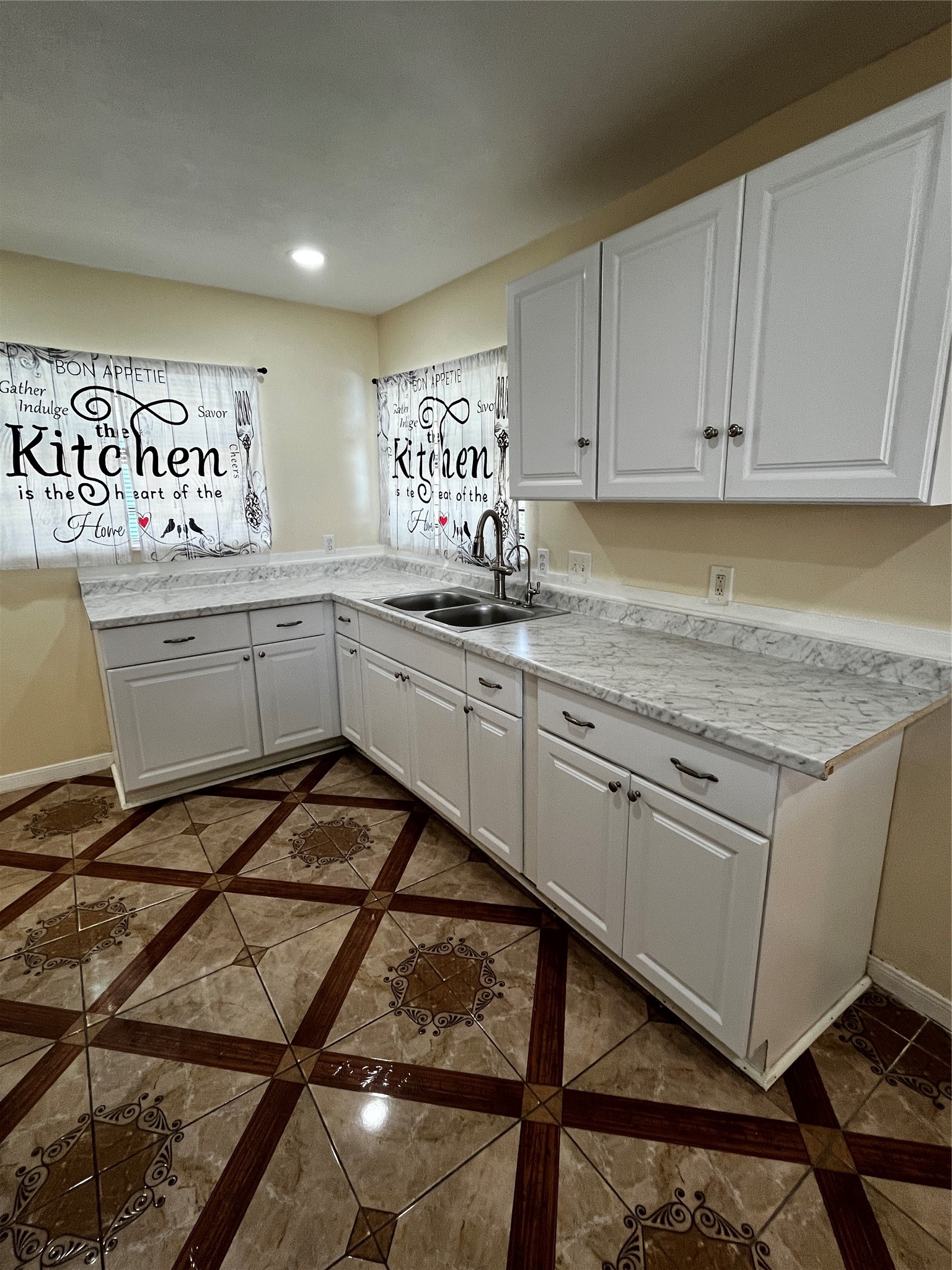 3163 Roe Drive Houston, TX 77087 - Photo 25 of 47 a kitchen with sink cabinets and window