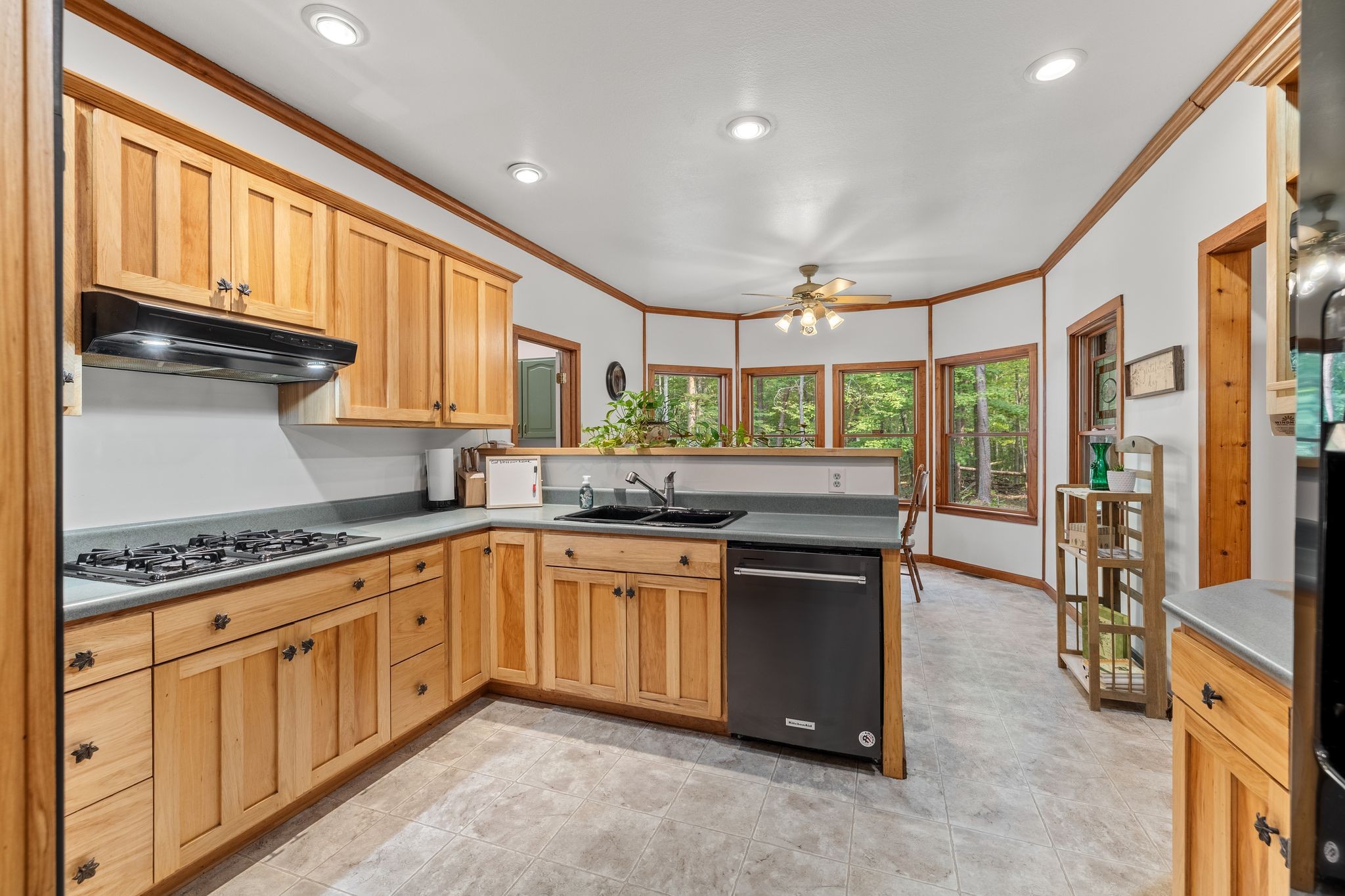 6245 Greentown Road Tracy City, TN 37387 - Photo 22 of 47 a kitchen with stainless steel appliances granite countertop a stove a sink and a refrigerator