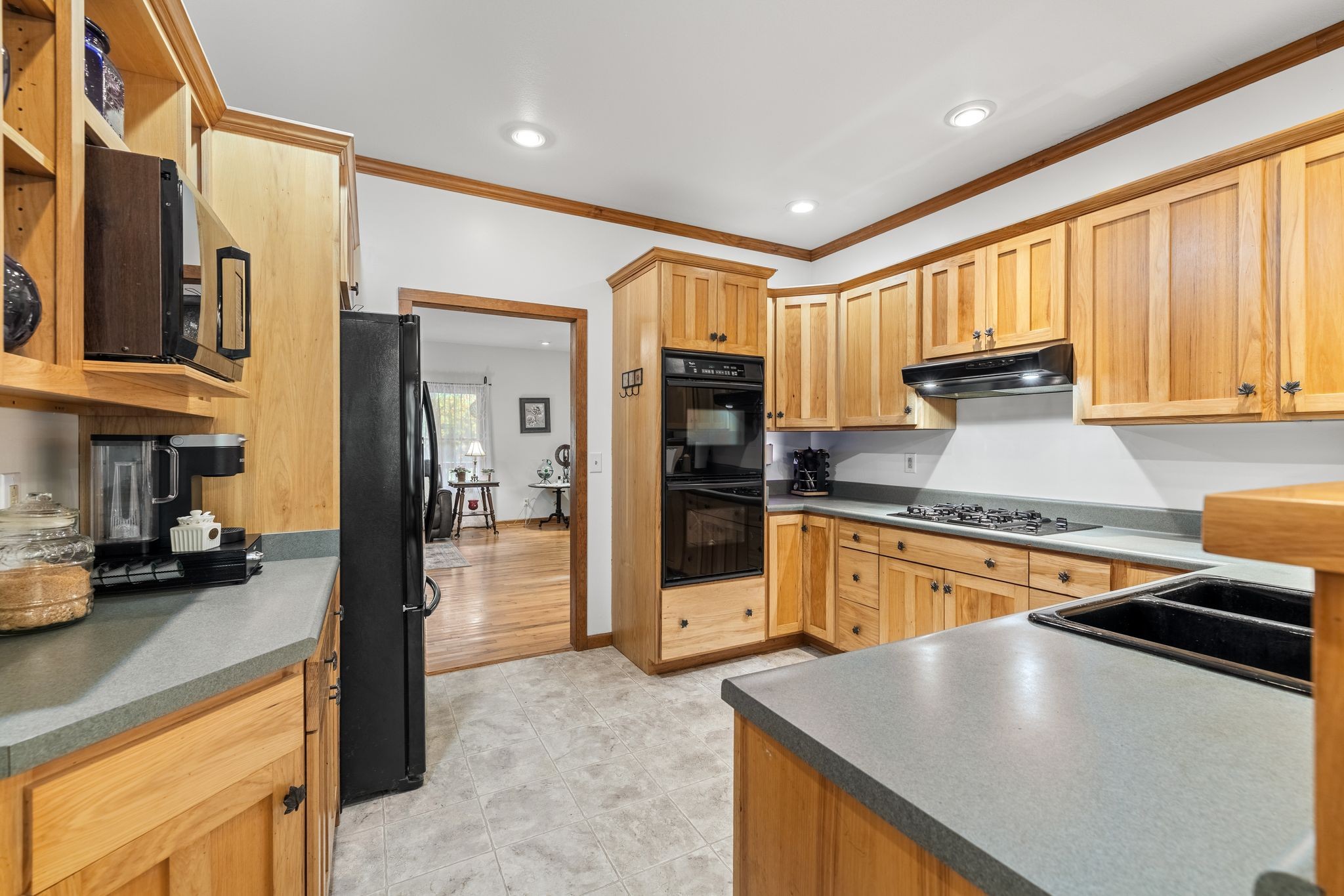 6245 Greentown Road Tracy City, TN 37387 - Photo 23 of 47 a kitchen with stainless steel appliances granite countertop a refrigerator a stove and a sink with cabinets