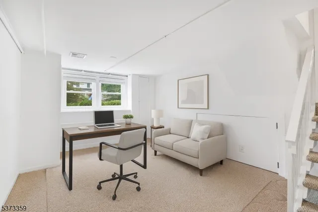 a work room with furniture and windows