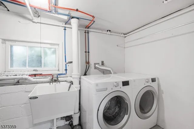 a view of a bathroom with sink and mirror