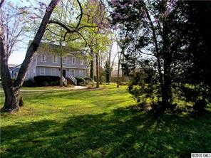 905 Concord Road Davidson, NC 28036 - Photo 1 of 15 a view of swimming pool and tree s