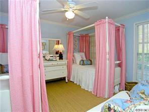 905 Concord Road Davidson, NC 28036 - Photo 12 of 15 a bedroom with a bed and a window