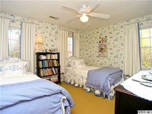905 Concord Road Davidson, NC 28036 - Photo 14 of 15 a bedroom with a bed furniture and a window