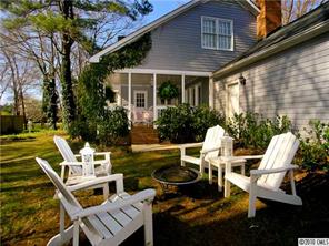 905 Concord Road Davidson, NC 28036 - Photo 3 of 15 a view of a patio with table and chairs and potted plants