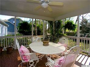 905 Concord Road Davidson, NC 28036 - Photo 4 of 15 a view of a patio with a table chairs and a table