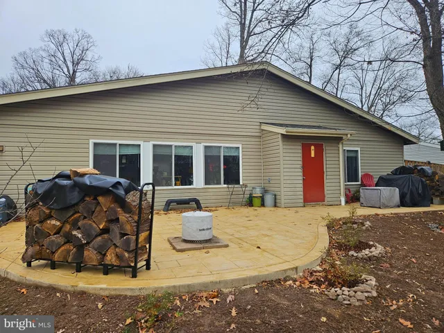 a kitchen with stainless steel appliances granite countertop a refrigerator sink and stove