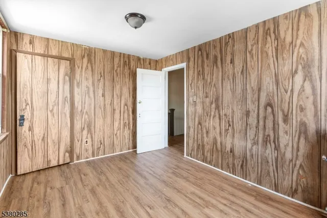 a view of a room with wooden walls
