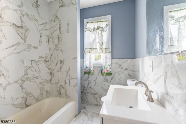 a bathroom with a sink and a bathtub
