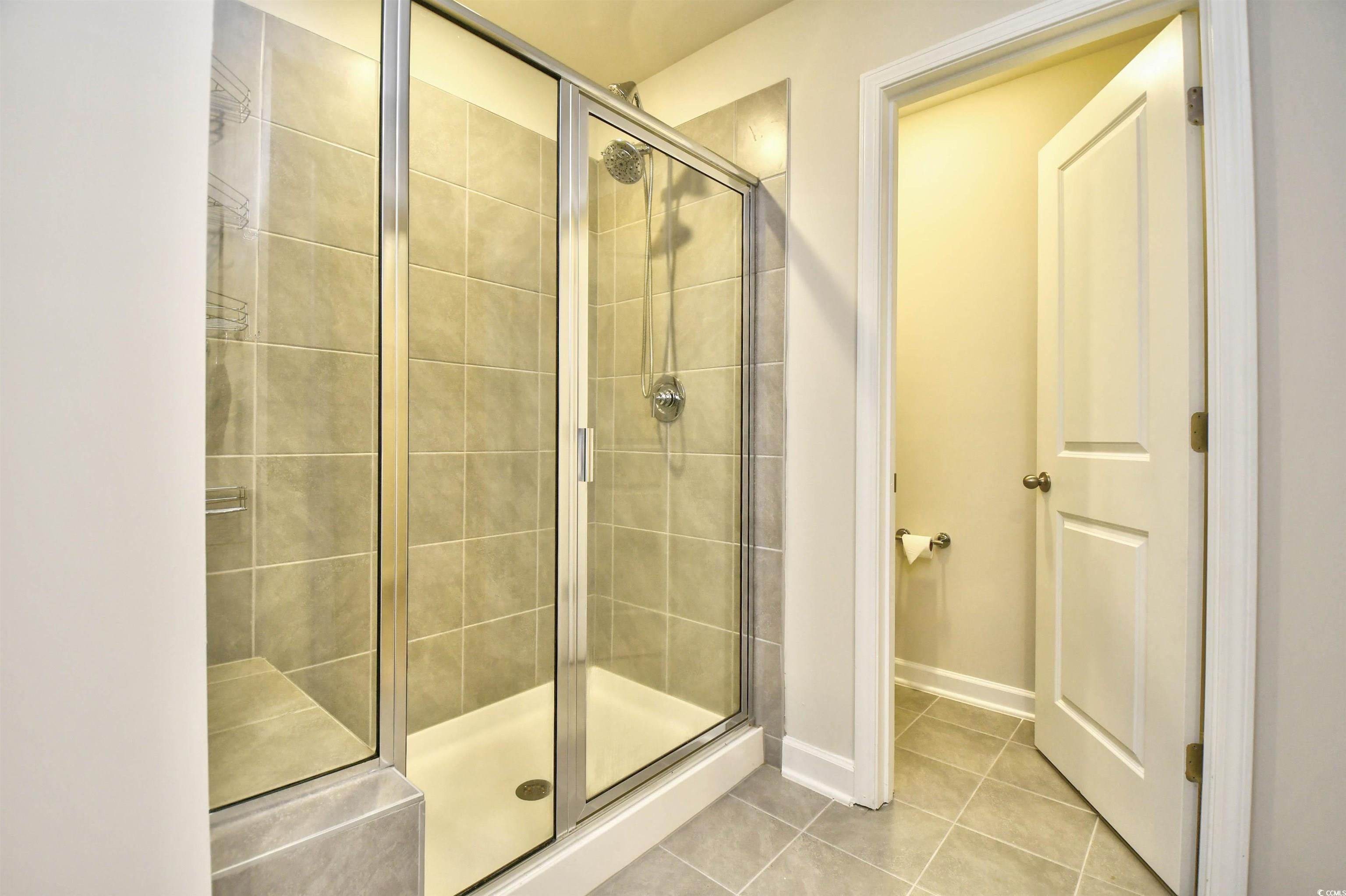 2325 Copper Crk Loop Longs, SC 29568 - Photo 25 of 40 Full bath featuring a stall shower and tile patterned floors